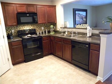 Gorgeous glass tile back splash, nice size pantry and refrigerator included