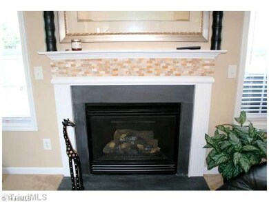 Den/Family/Great Room. Gas Log Fireplace in Great Room..note detailed custom stone work on Mantel.
