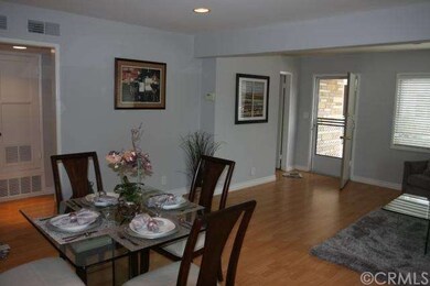 Dining area, living room and front door.