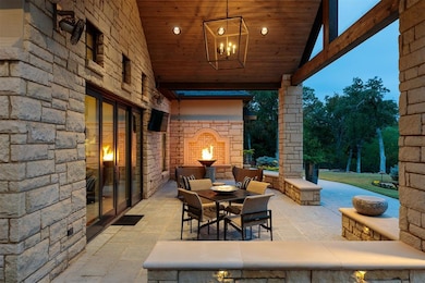 View of patio / terrace with an outdoor stone fire