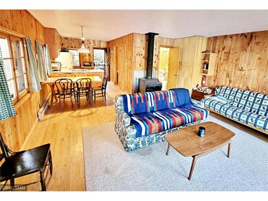 Open floor plan cabin with wood burning stove