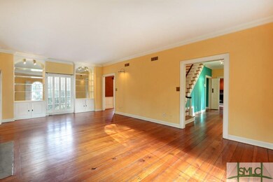 Formal Living Room with view into foyer and stairc