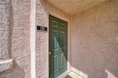 View of exterior entry featuring stucco siding