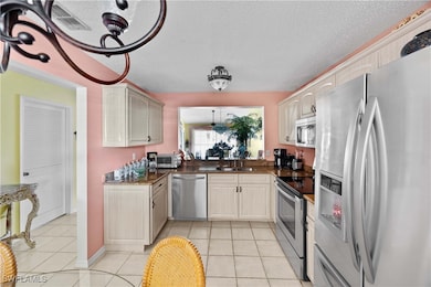 Kitchen featuring appliances with stainless steel