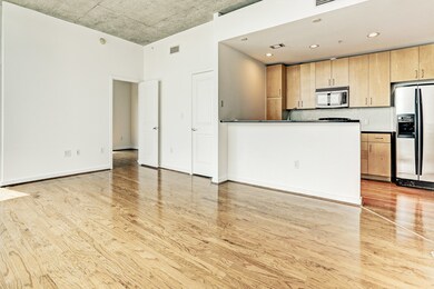 The kitchen, overlooking the living room, has a br