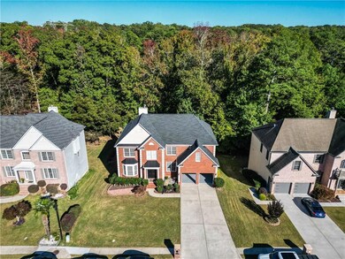 Birds eye view of property featuring a view of trees