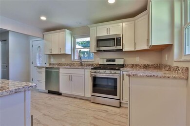 Beautifully designed kitchen with brand new hardwo