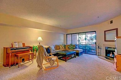 Wide, open living room with plush carpet and a fir