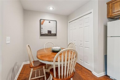 Dining room featuring dark wood finished floors, baseboards, and recessed lighting
