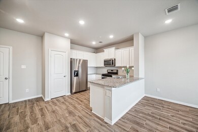 KITCHEN: This cozy kitchen opens up to the living