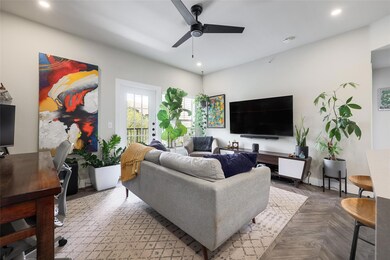 Living area with a ceiling fan, recessed lighting