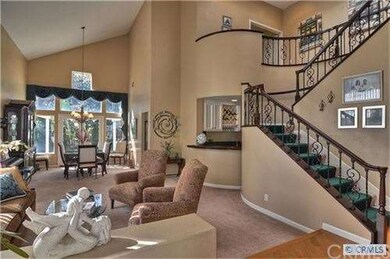 Entry towards Living Room and Dramatic Wrought Iro