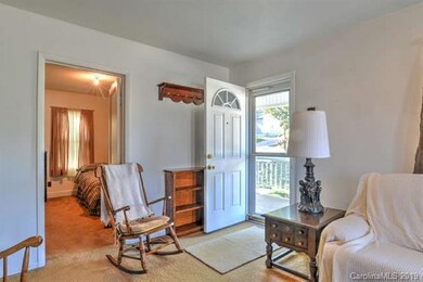 Living Room - (* Hardwood floors under carpet per Seller)