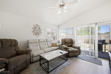 Living room featuring wood finished floors, plenty