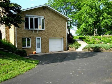 Exterior Back. Side entry to home through an attac