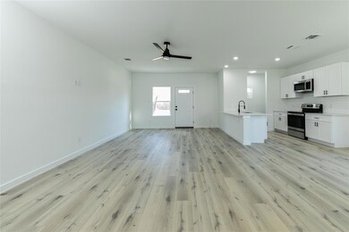 Unfurnished living room with ceiling fan, light wo