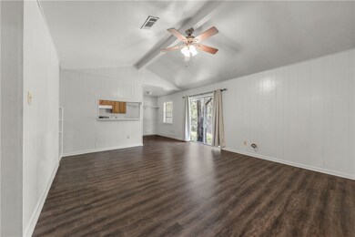 Unfurnished living room with dark wood-style floor