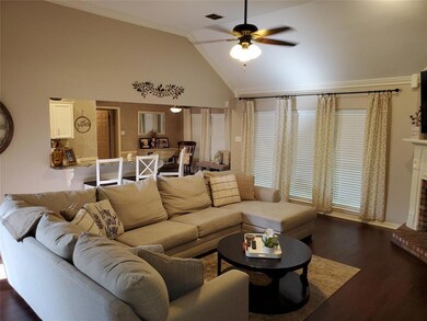 Open living room with vaulted ceiling.