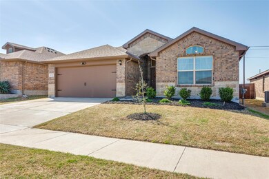 View of front of home with a front yard, brick sid