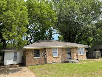 Single story home with stone siding, a shingled ro