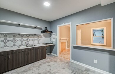 Kitchen with gas cooktop, cabinets, countertop and
