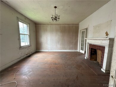 Unfurnished living room featuring a notable chande