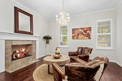Sitting room featuring dark wood-style flooring, 