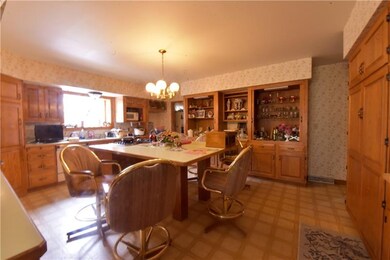 Another view of the kitchen, which has a wet bar as well.