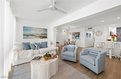 Living area featuring a ceiling fan, wood finished