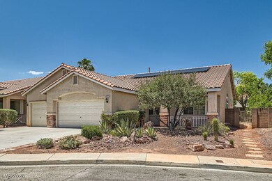 View of front of home featuring a garage, stucco s