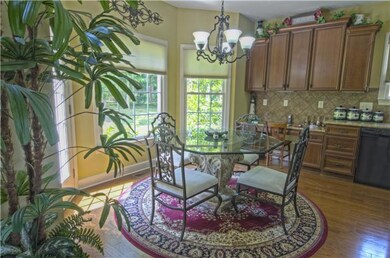 Breakfast area provides bay windows and built-in desk/work station.