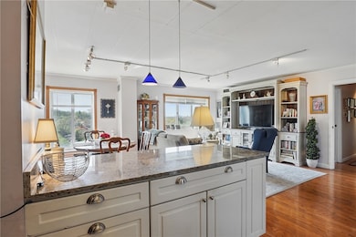 The updated countertops extend into a stylish brea