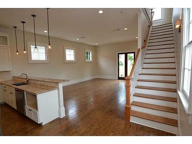 Photo. Entry into the open concept kitchen/living/