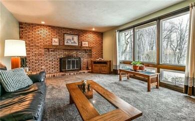 The large Living Room with a log burning fireplace
