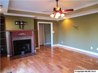 Beautiful hardwood floors trey ceiling, fan, crown molding.