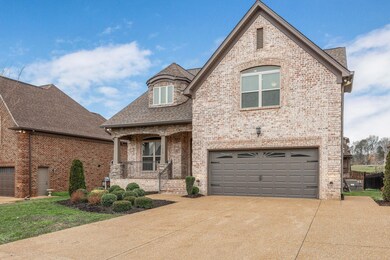 All-Brick home with spacious front porch.  Extra Parking Pad!