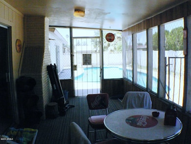 Screened-in back porch.
