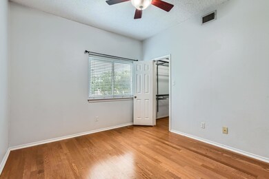 Unfurnished bedroom featuring baseboards, wood fi