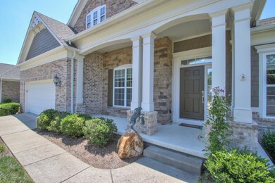 Covered front porch; brick & stone accent the front of this beauty.