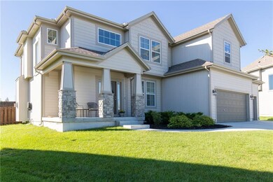 Unusual wrap-around front porch has nice for potte