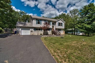 The home features a fully paved driveway and is se