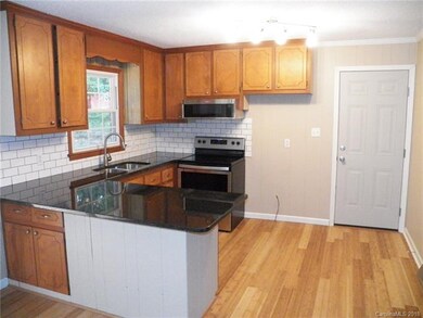 UPDATED KITCHEN WITH GRANITE COUNTER TOPS AND APPL