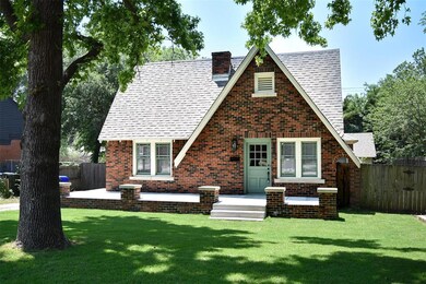 Tudor house with a front yard