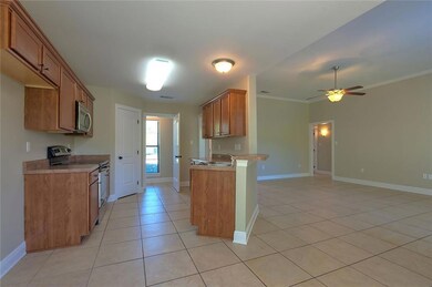 Kitchen with Panty and Laundry Room in the backgro