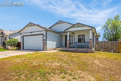 View of front of home featuring a porch, an attached garage, and concrete driveway