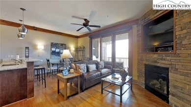 Living Area with Hardwoods & Gas Fireplace