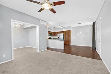 Unfurnished living room with baseboards, ceiling f