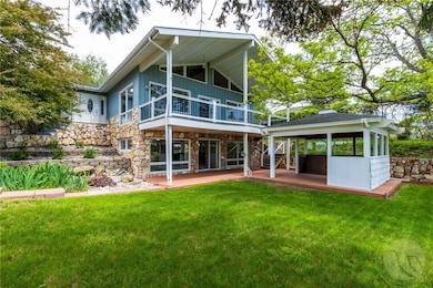 Front view with gazebo and mature trees
