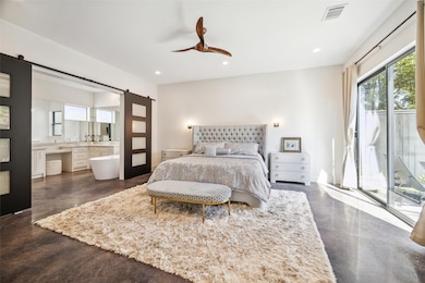 SPACIOUS PRIMARY WITH BARN DOORS THAT LEAD TO THE