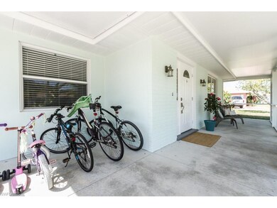 Front screened porch...with family bicycle parking